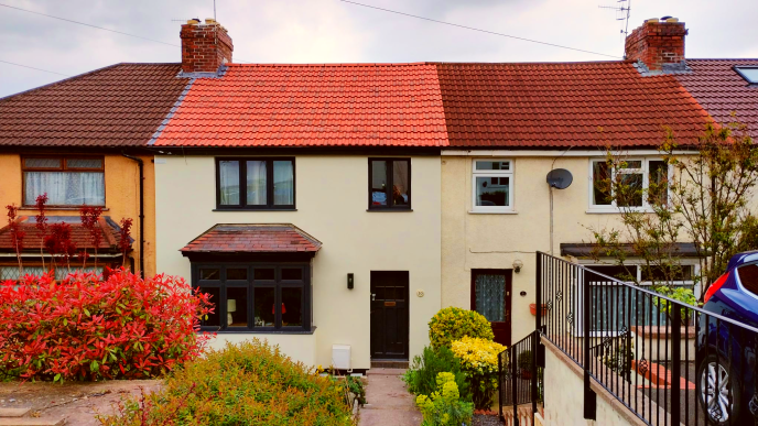terraced house with a smooth cream coloured exterior wall insulation